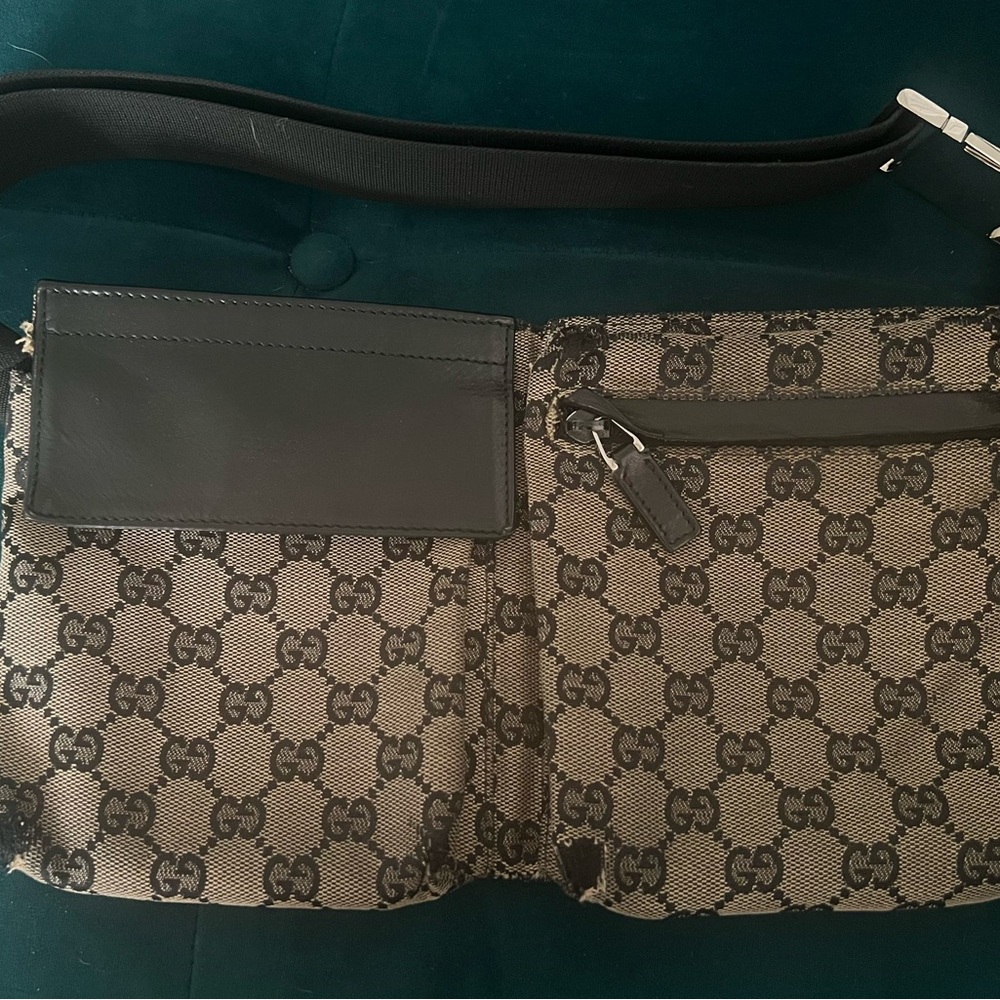 Very Preloved Gucci black/tan Monogram GG Belt Bag with black leather details.